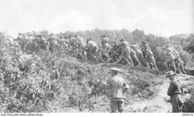 Gallipoli Peninsula, Turkey. 26 April 1915. Australian artillerymen dragging guns into position after the landing at Anzac. By 6 p.m. on the first evening one gun had been placed on the neck above the southern end of Ari Burnu beach, and next day more guns were dragged over this neck into positions to the right.